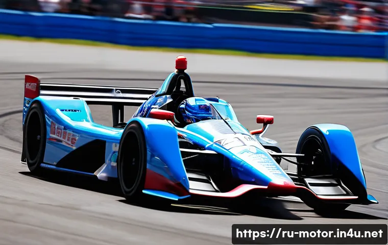 인디카 레이싱 머신 특성 - 2-liter V6 twin-turbo engine's power is palpable, with heat shimmering above the exhaust. The driver...